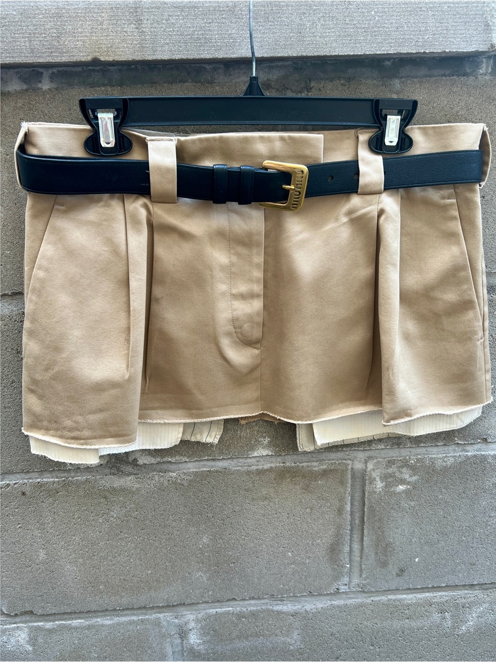 The iconic Miu Miu Spring/Summer 2022 pleated mini skirt.